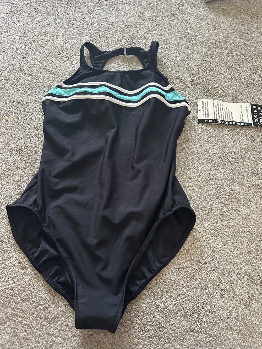 Women’s trim shaper size 18 aqua and black one piece. New with tags.